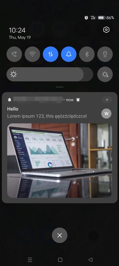 Smartphone preview of a notification with an image of a laptop